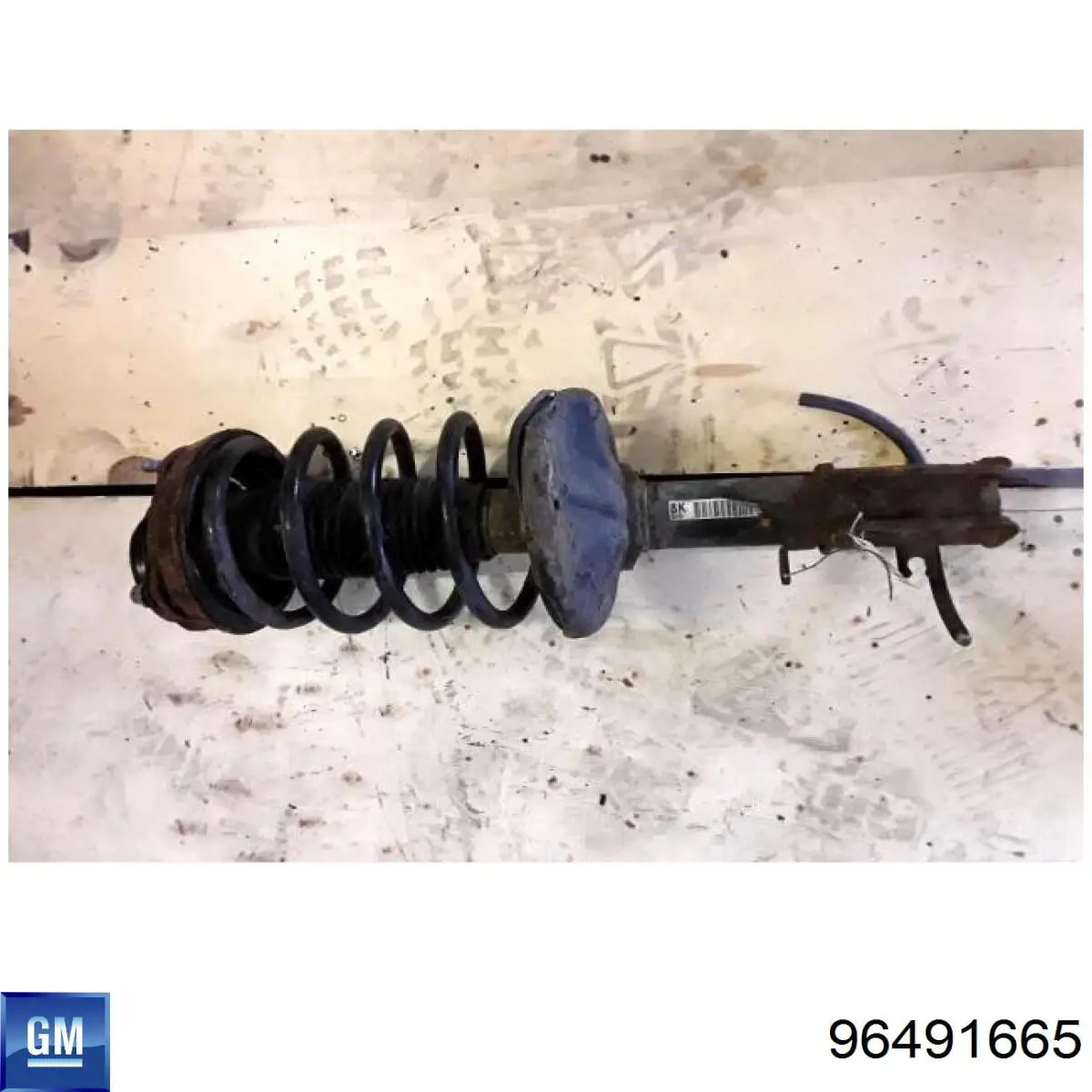 Амортизатор передний левый 96491665 General Motors