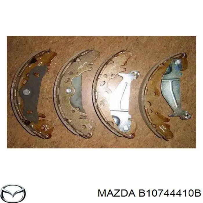 B10744410E Mazda Трос ручного тормоза задний, правый