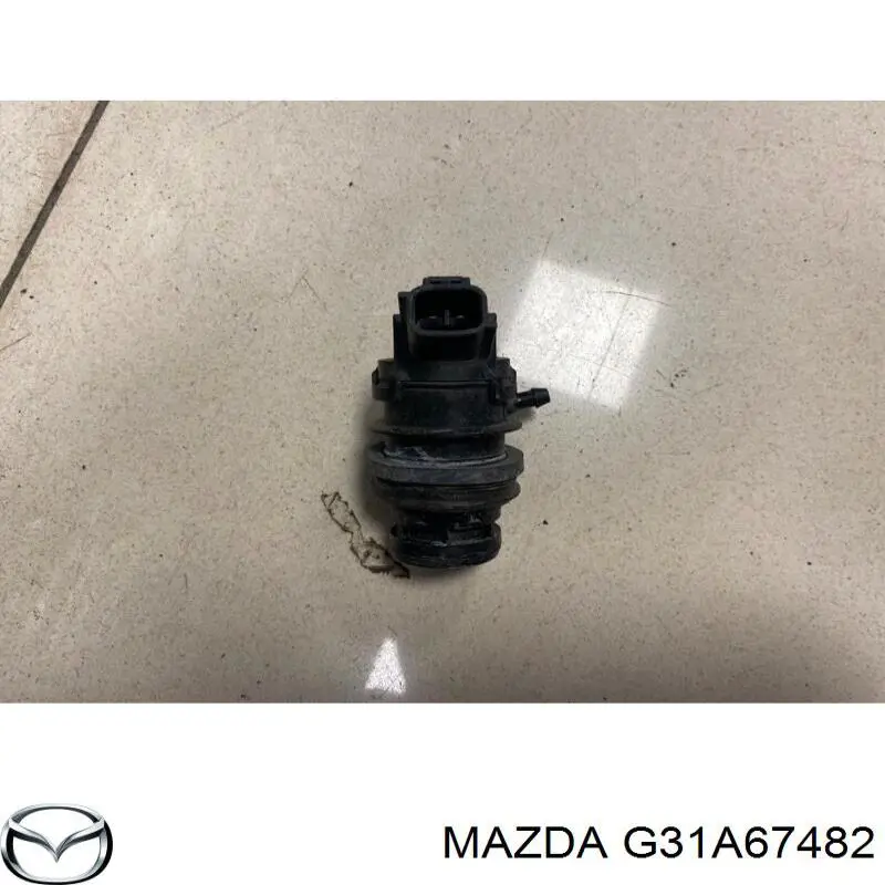 Bomba de limpiaparabrisas trasera G31A67482 Mazda