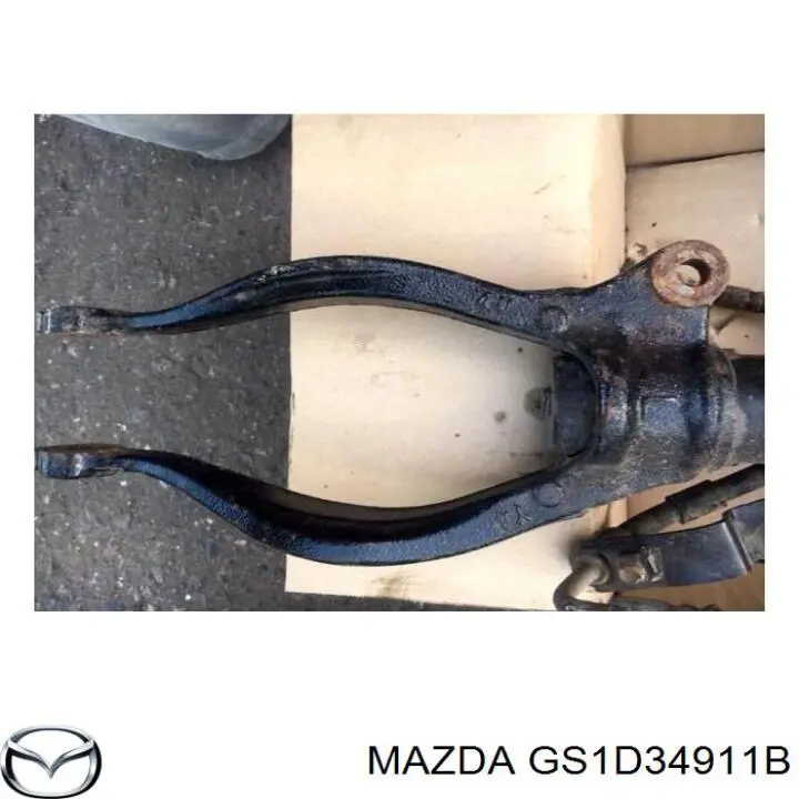 GS1D34911B Mazda Вилка амортизатора переднего нижняя левая