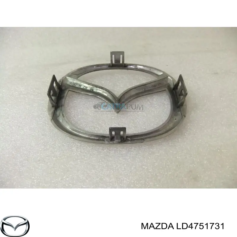 Эмблема решетки радиатора LD4751731 Mazda