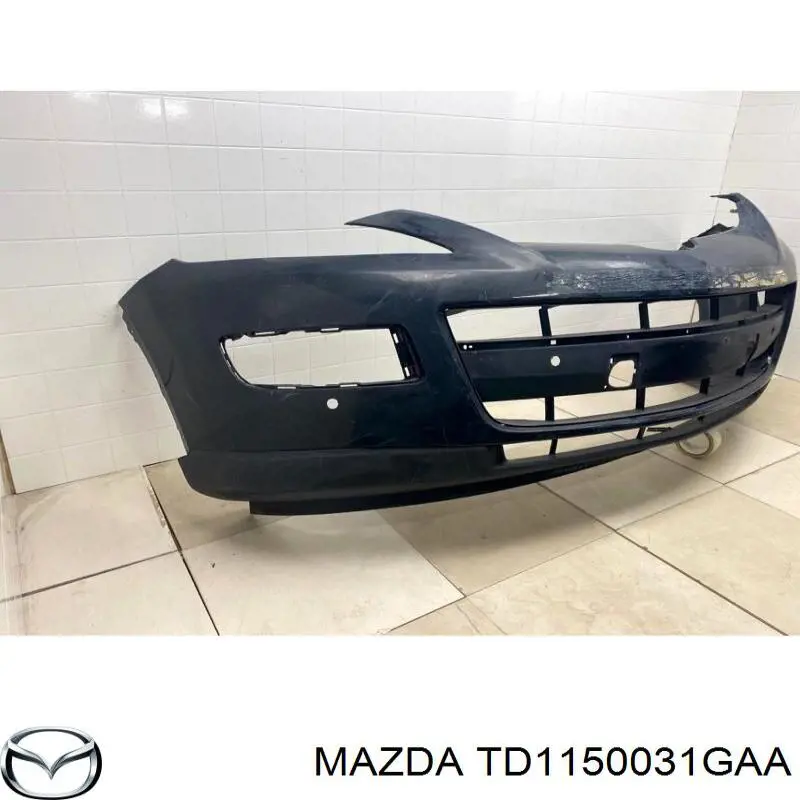 Передний бампер TD1150031GAA Mazda