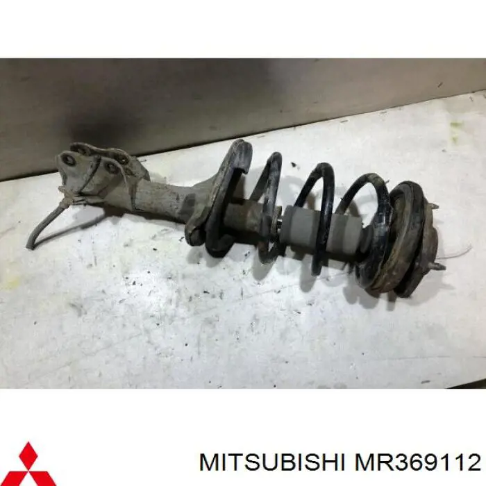 Купить MR369112 Mitsubishi Амортизатор подвески передний левый