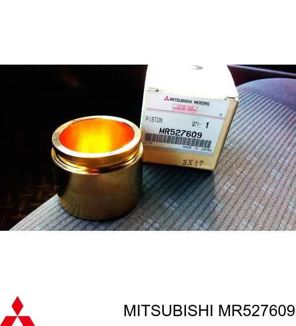MR527609 Mitsubishi поршень суппорта тормозного переднего