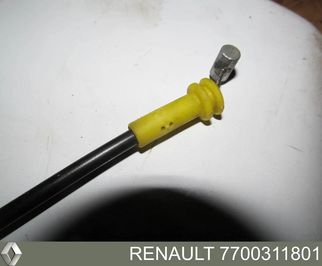 7700311801 Renault (RVI) cabo (pedal de abertura do fecho da porta dianteira)