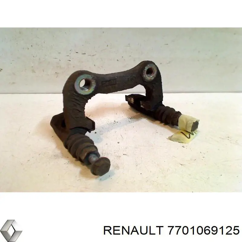 7701069125 Renault (RVI) braçadeira do freio de suporte traseiro