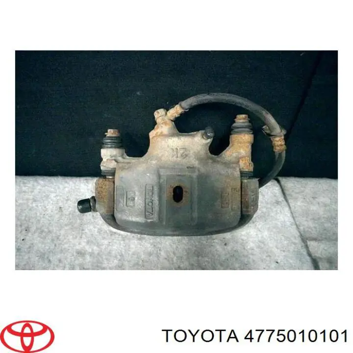 4775010101 Toyota суппорт тормозной передний левый