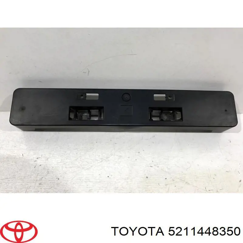 Панель крепления номерного знака переднего Toyota 5211448350