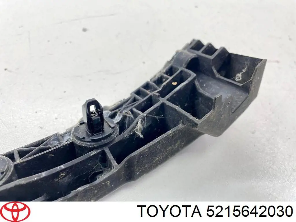 Купить 5215642030 Toyota Левый кронштейн крепления бампера заднего