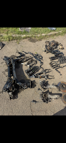 Стойка амортизатора задняя GS1D28700F MAZDA