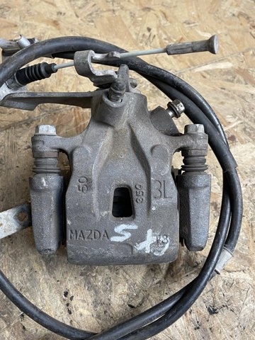Суппорт тормозной левый задний K0Y12699Z MAZDA
