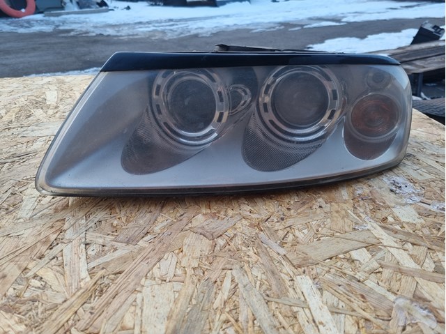 Фара левая 7L6941015BK VAG