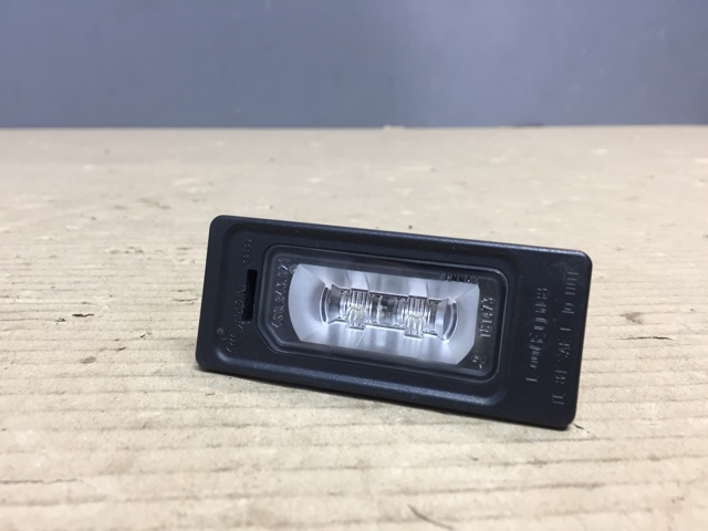Фонарь подсветки заднего номера 4G0943021 VAG