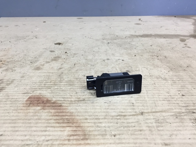 Фонарь подсветки заднего номера 63267165646 BMW
