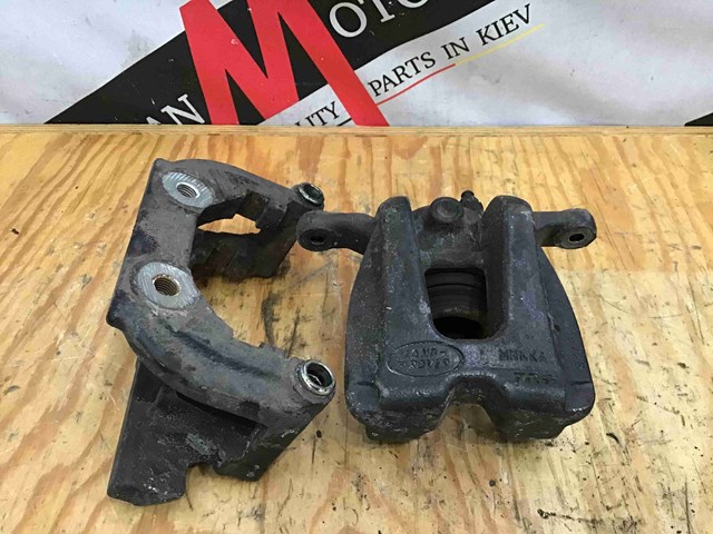 Суппорт тормозной задний правый AH422D048BA LAND ROVER
