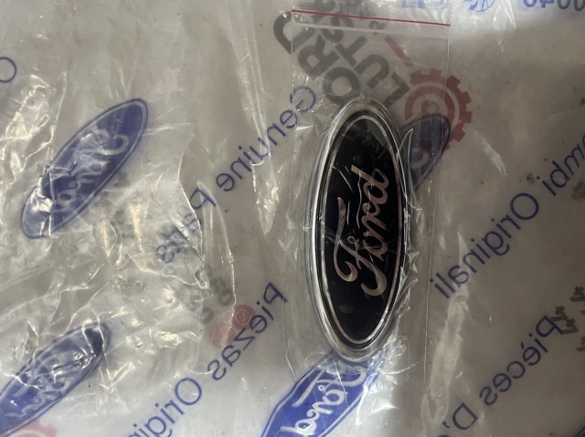Фирменный значок 7U5A19H250AB FORD