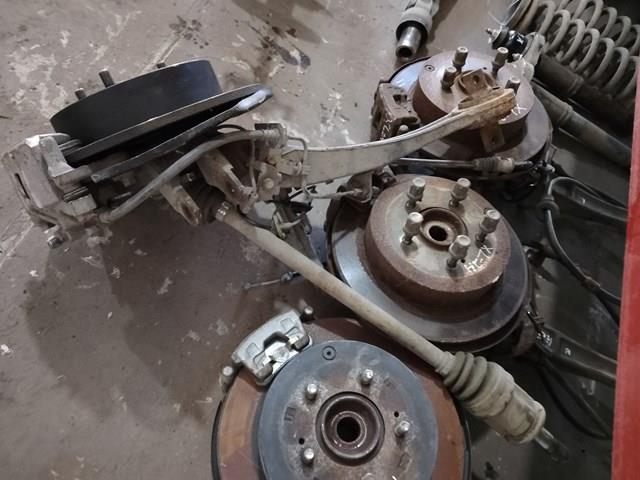 Рычаг/тяга задней подвески продольный нижний, левый 4125A033 MITSUBISHI