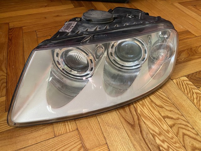 Основная фара в сборе левая 7L6941015BK VAG