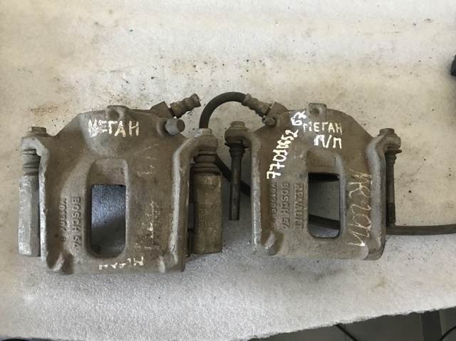 Суппорт тормозной, передний, правый 7701065267 RENAULT
