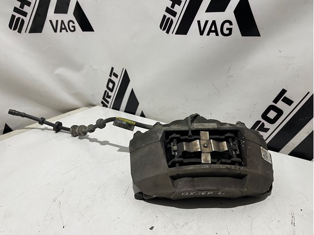 Суппорт тормозной передний левый 8R0615107F VAG