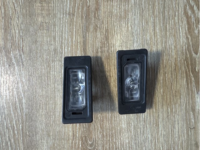 Фонарь подсветки заднего номера 5NA943021 VAG
