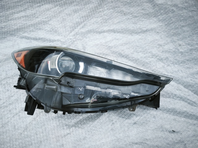 Вставка фары правой KB8A51030 MAZDA