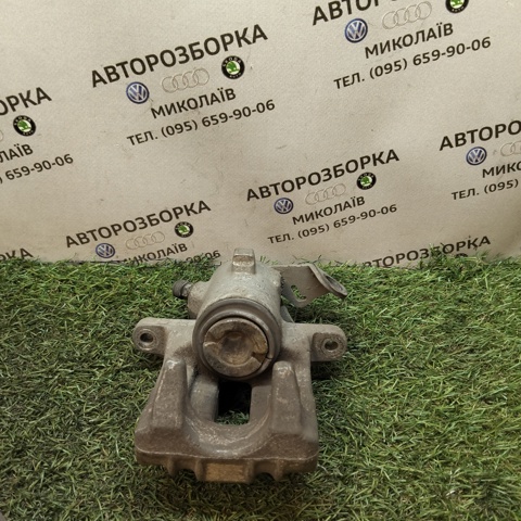 Суппорт тормозной левый задний 6R0615423 VAG