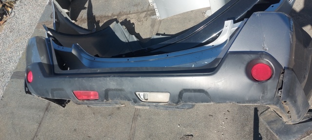 Бампер задний 85022JG04H NISSAN