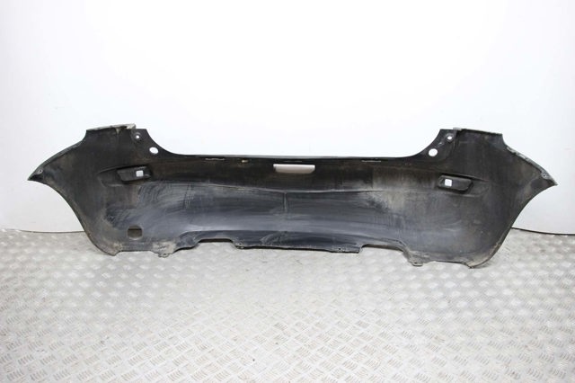 Задний бампер 850229U040 NISSAN
