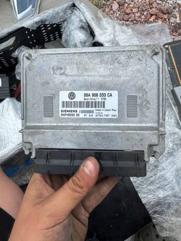 Компьютер двигателя 06A906033CA VAG