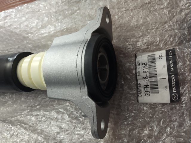 Стойка амортизатора задняя GBFN28910B MAZDA
