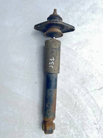 Задний амортизатор 562109Y106 NISSAN