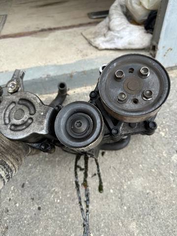 Натяжитель клинового ремня R2AA15980D MAZDA