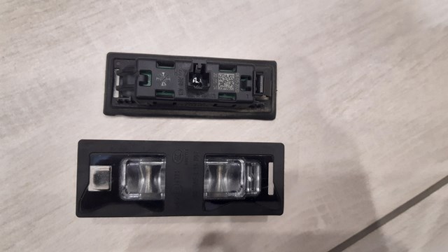 Фонарь подсветки заднего номера 8W6943021 VAG