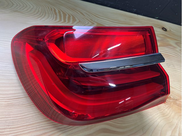 Задний левый внешний фонарь 7342965 BMW