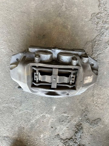 Суппорт тормозной передний левый 104462100D Tesla Model