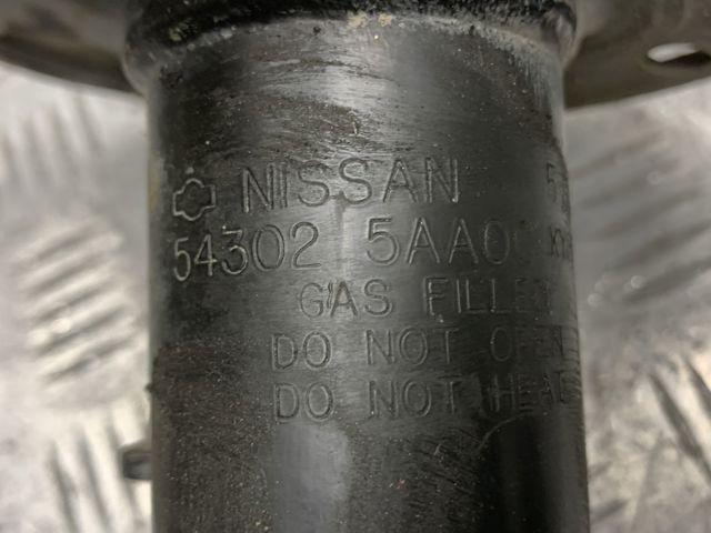 Амортизатор подвески передний правый E43025AA0C NISSAN