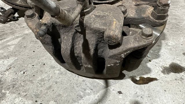 41011VK100 NISSAN Суппорт тормозной передний левый купить в Харьков