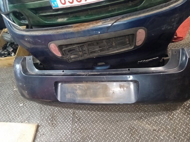 Бампер задний 1404311 OPEL