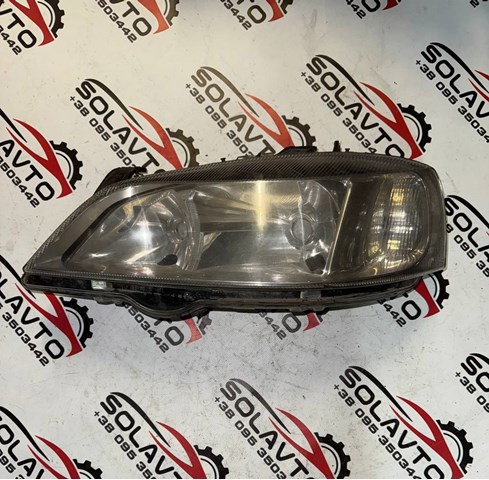 Фара основная левая 90520877 OPEL