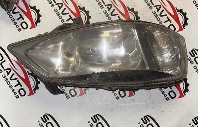 Вставка фары правой 90520878 OPEL