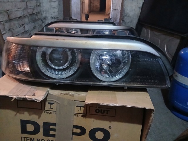 Фара левая 6912435 BMW