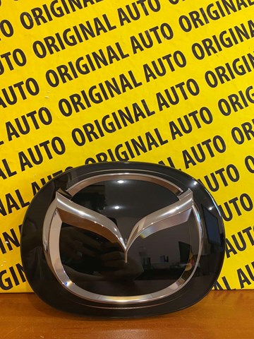 Фирменный значек капота TK7951730 MAZDA