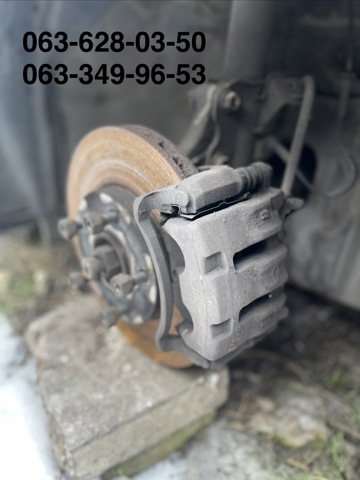 Суппорт тормозной, передний, левый 41011WA200 NISSAN
