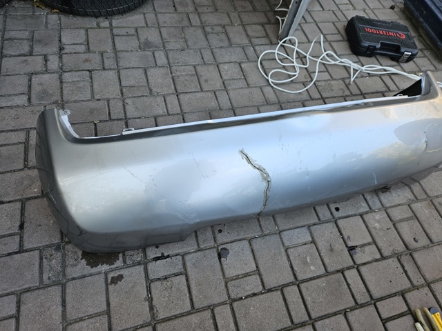 Бампер задний 85022AX640 NISSAN