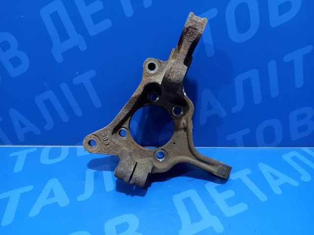 Цапфа - поворотный кулак передний, левый 28313SC010 SUBARU