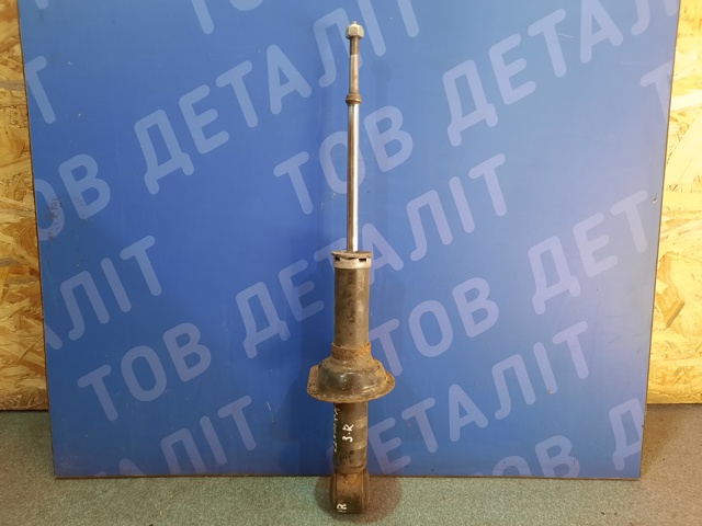 Стойка амортизатора задняя Митсубиси Лансер X