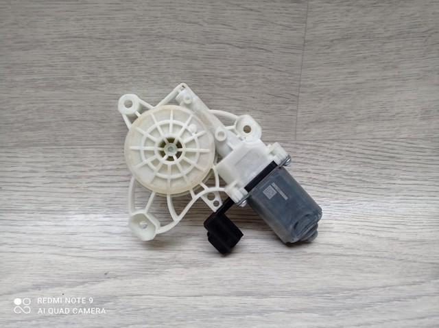 Мотор стеклоподъемника двери передней, левой JX7B14553BA FORD