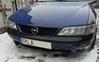 Бампер передний 90512523 OPEL