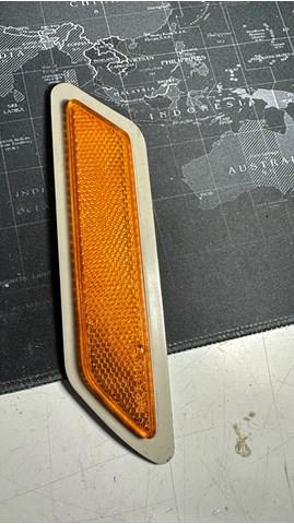 7274521 BMW Катафот (отражатель) переднего бампера левый купить в Украина